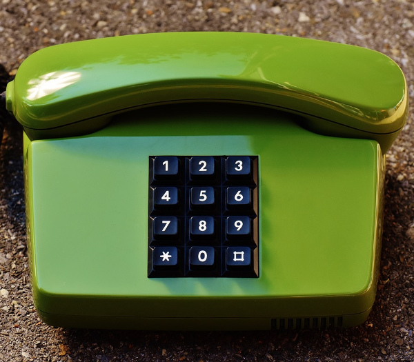 A photo of a green telephone.